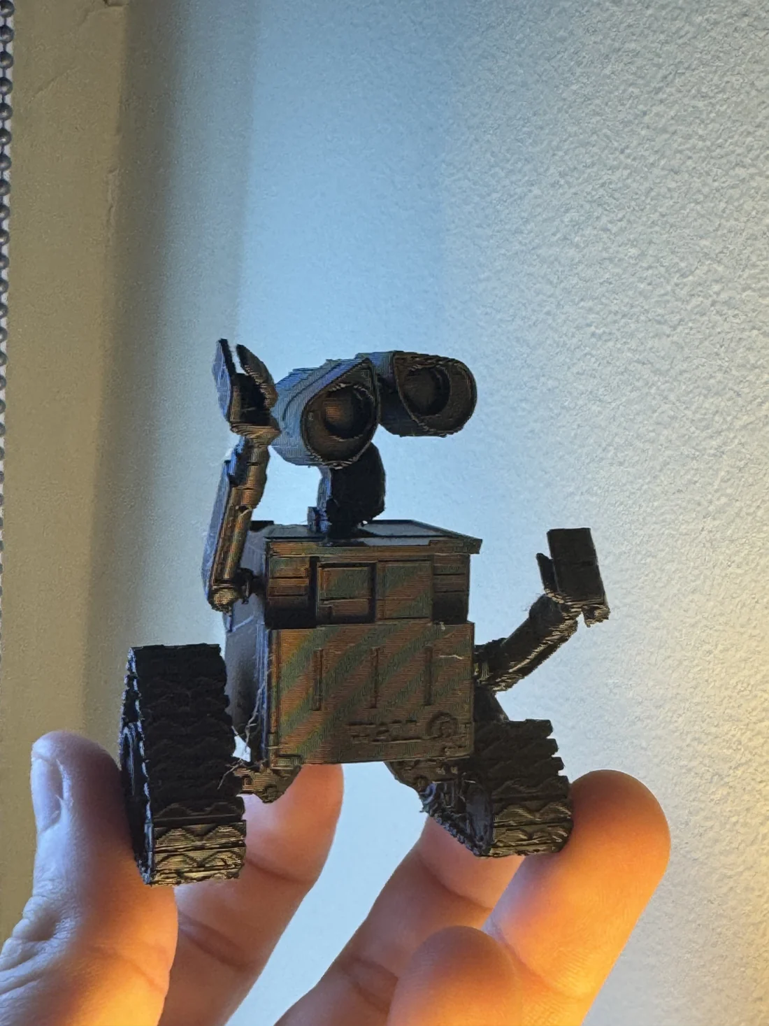 The actual WALL-E 3D print held by James Bell